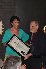 Kathy Kallaus presenting Mike Mass his Silver Medallion and Certificate.