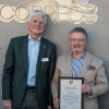 John Nicholas resents the Society Diploma to Harold Heckle